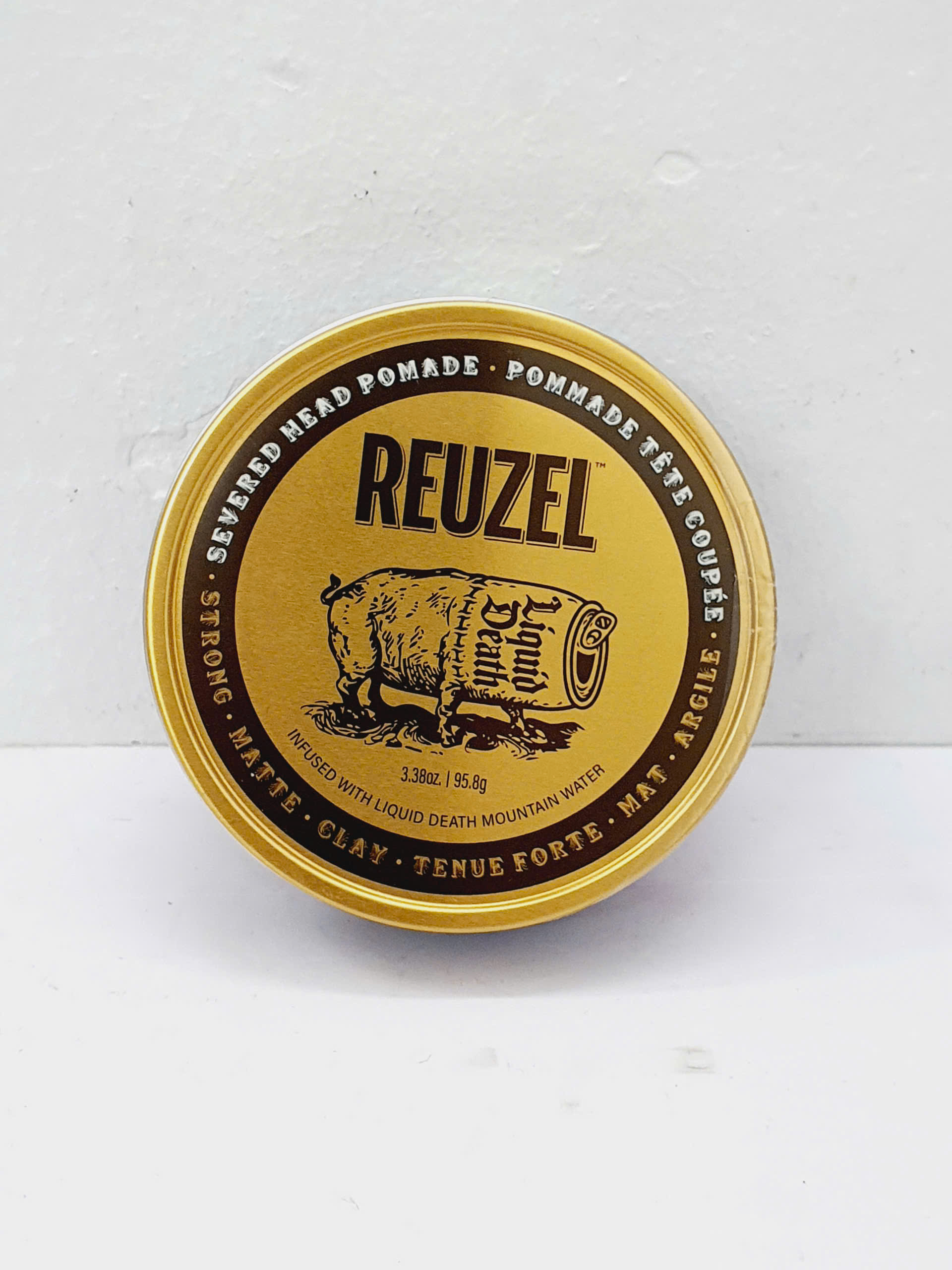 Sáp Reuzel Severed Head Pomade giữ nếp tóc cứng khô không bóng 95g